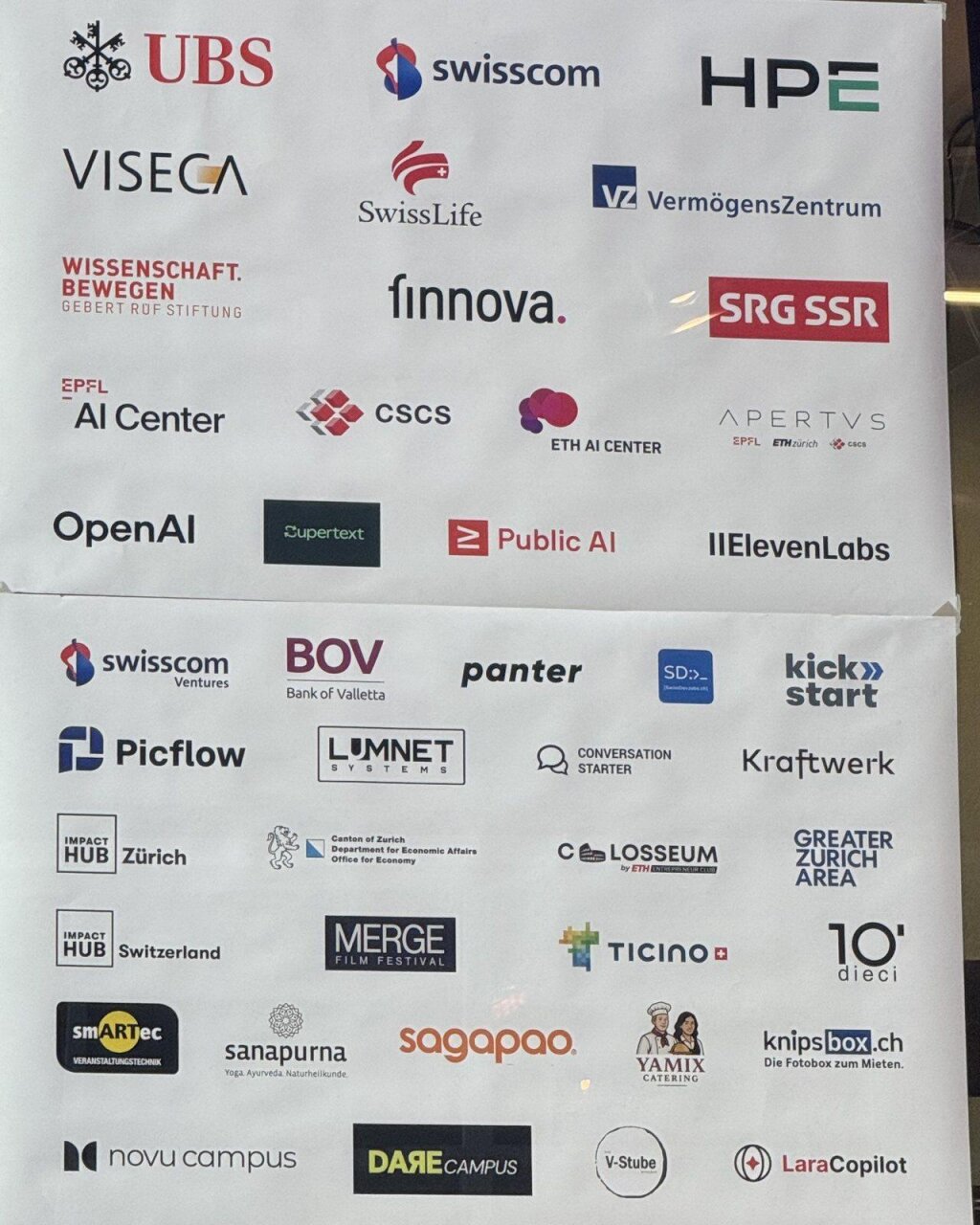 LaraCopilot's logo on the Zurich Hackathon partner wall alongside the event's other sponsors.