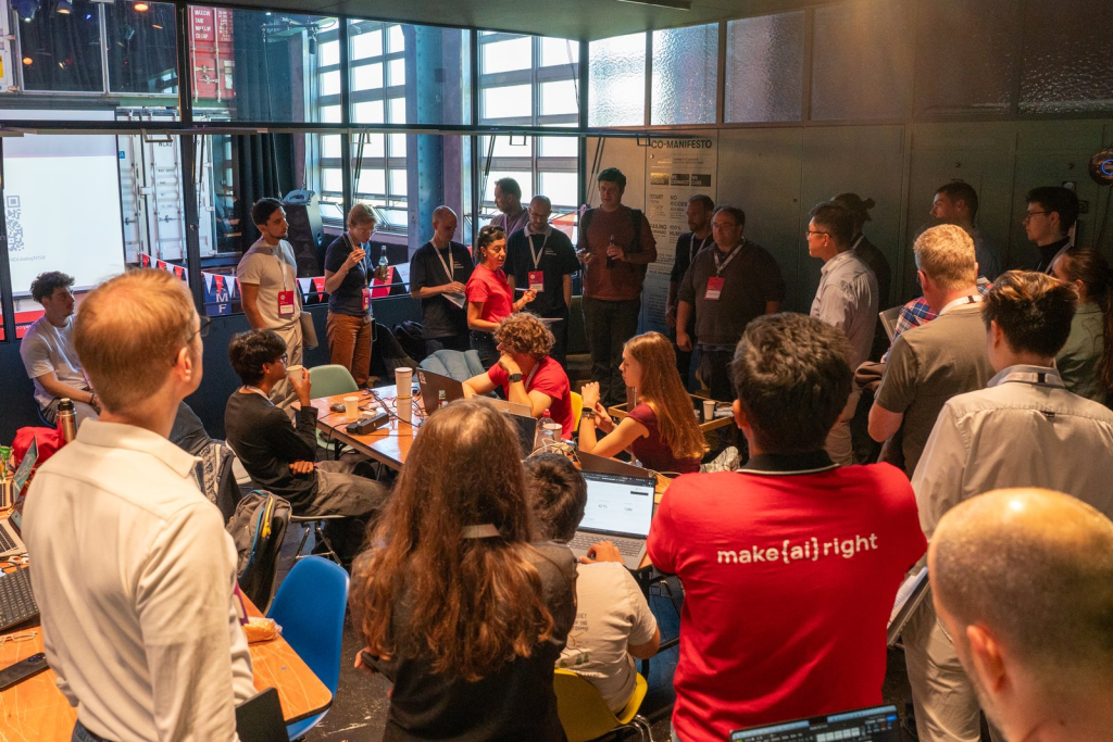 A hackathon team walking the room through their build.
