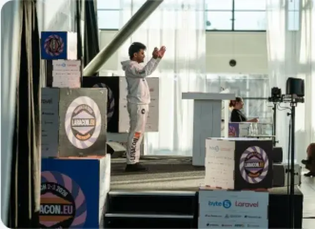Vishal Rajpurohit presenting on stage at Laracon EU