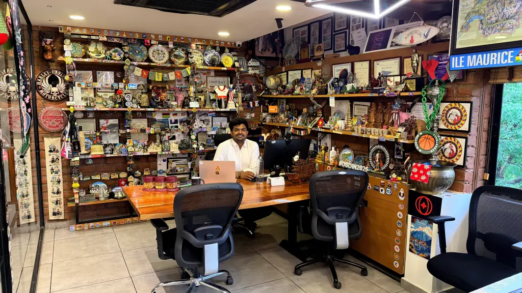 Vishal Rajpurohit's desk, its shelves covered with souvenirs, certificates and conference memorabilia collected across 35+ countries.